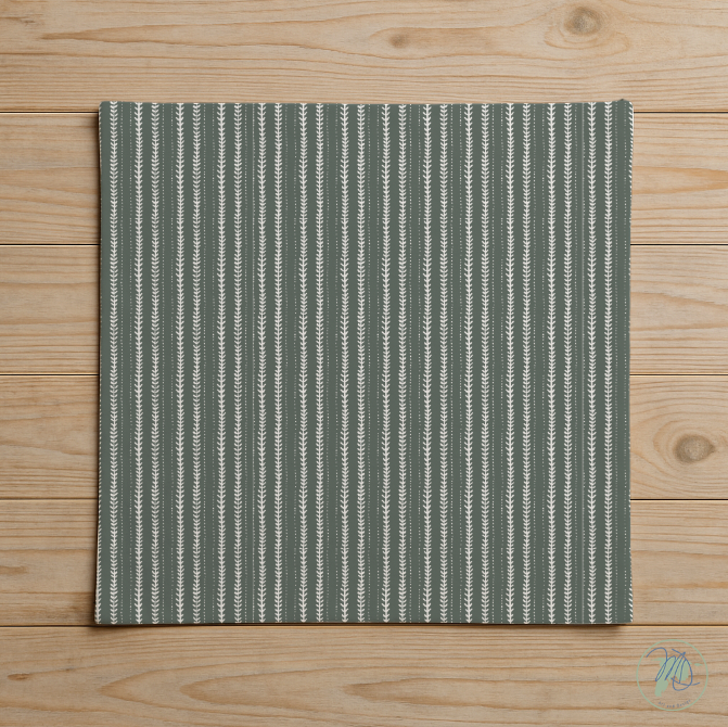 Green and white striped rug on a wooden floor