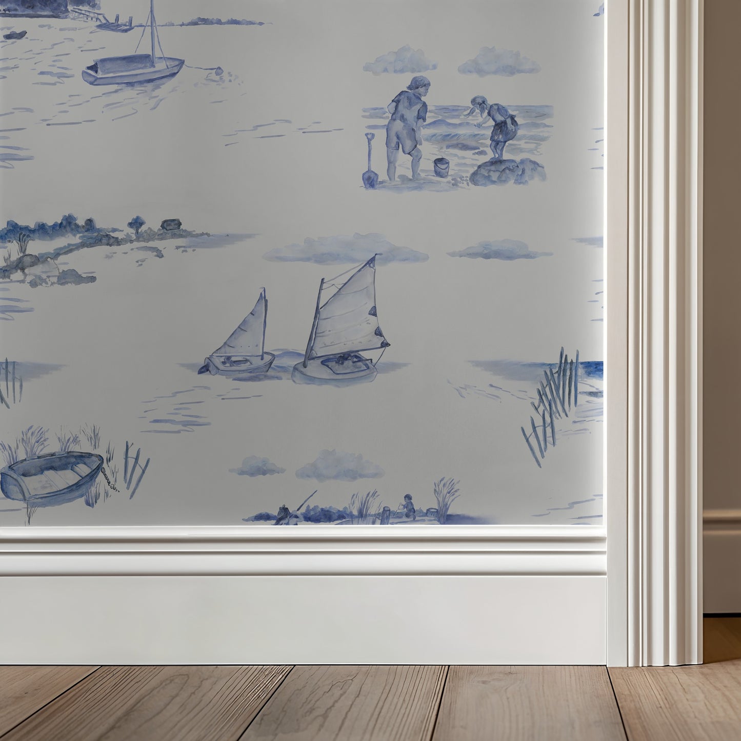Wallpaper with blue beach scene design on a neutral wall.