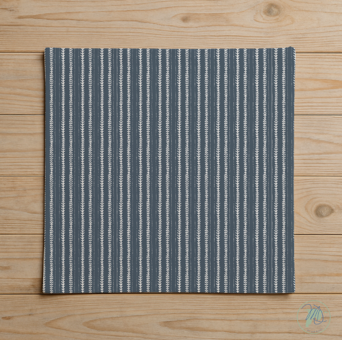 Blue and white striped fabric on a wooden surface
