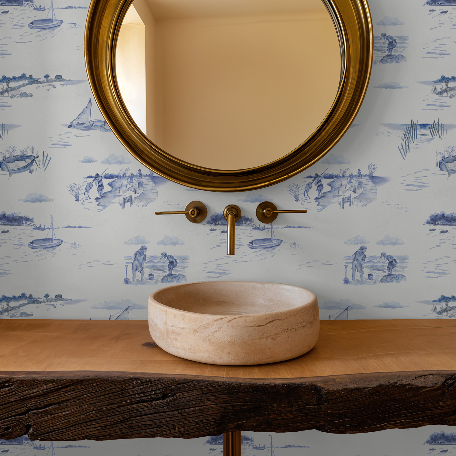 Bathroom vanity with stone sink, gold faucet, and round mirror against a decorative wallpaper.