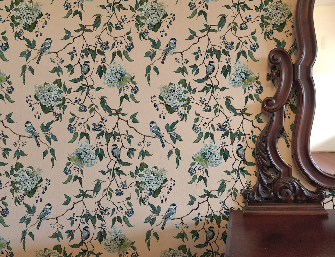 Wallpaper with floral and bird pattern next to a wooden mirror