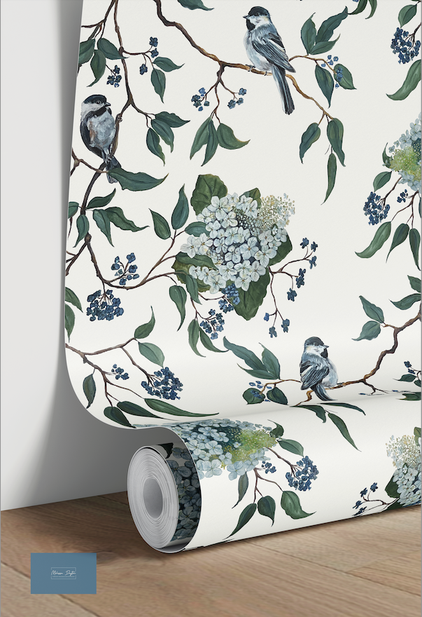Roll of wallpaper with floral and bird design on a white background