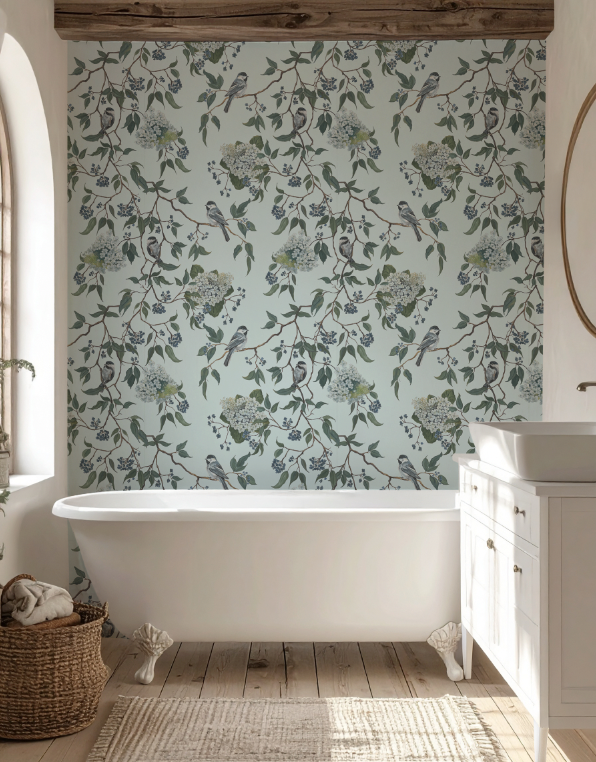 Bathroom with floral wallpaper, freestanding bathtub, and wooden floor.