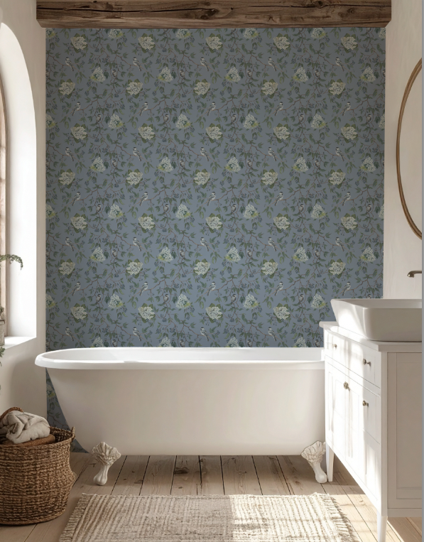 Bathroom with floral wallpaper, freestanding bathtub, and wooden floor.