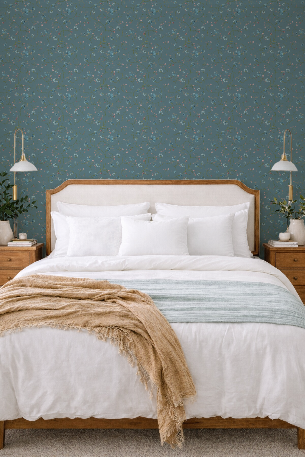 Bedroom with wooden bed, white bedding, and decorative pillows against a patterned blue wall.