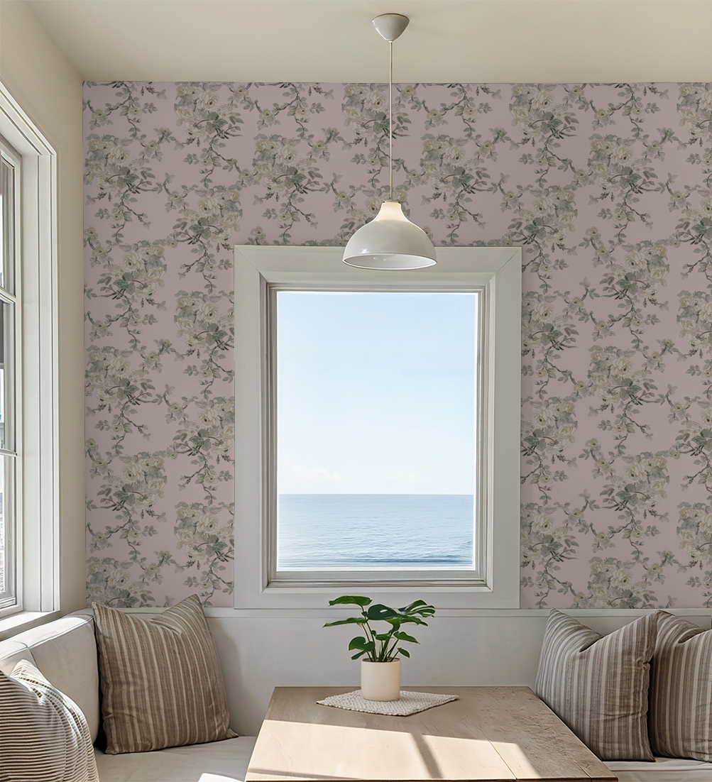 Living room with floral wallpaper, a window overlooking the ocean, and a plant on a table.