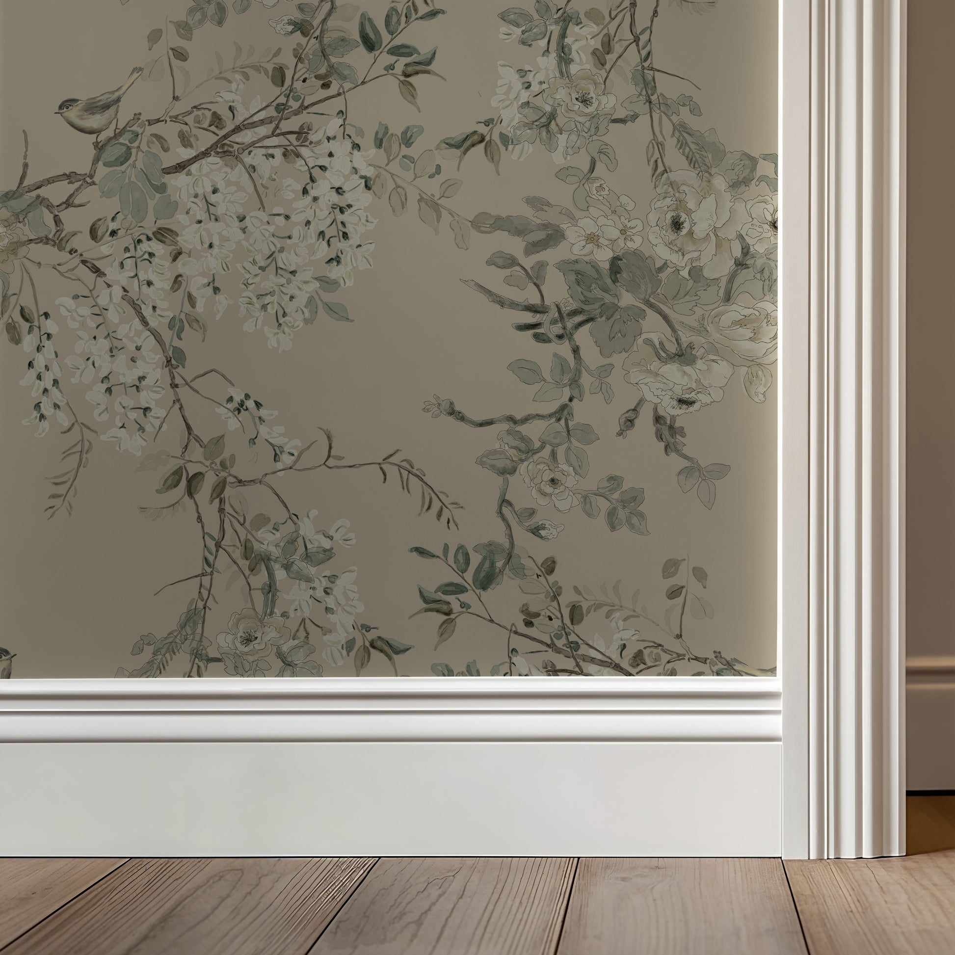 Floral wallpaper with greenery on a neutral wall with wooden flooring.