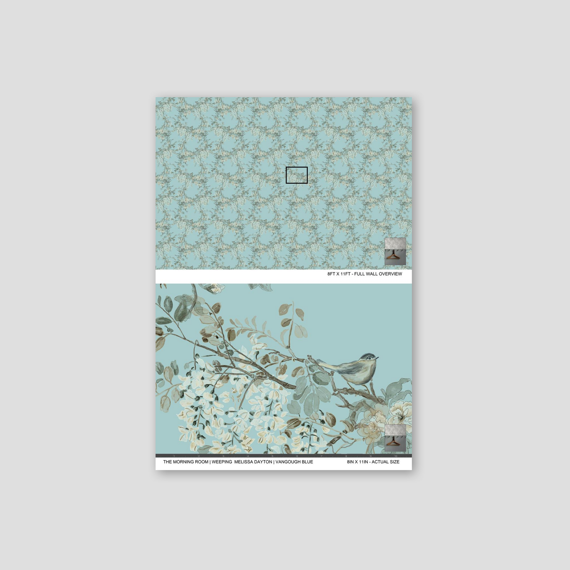 Notebook with floral and bird design on a light gray background