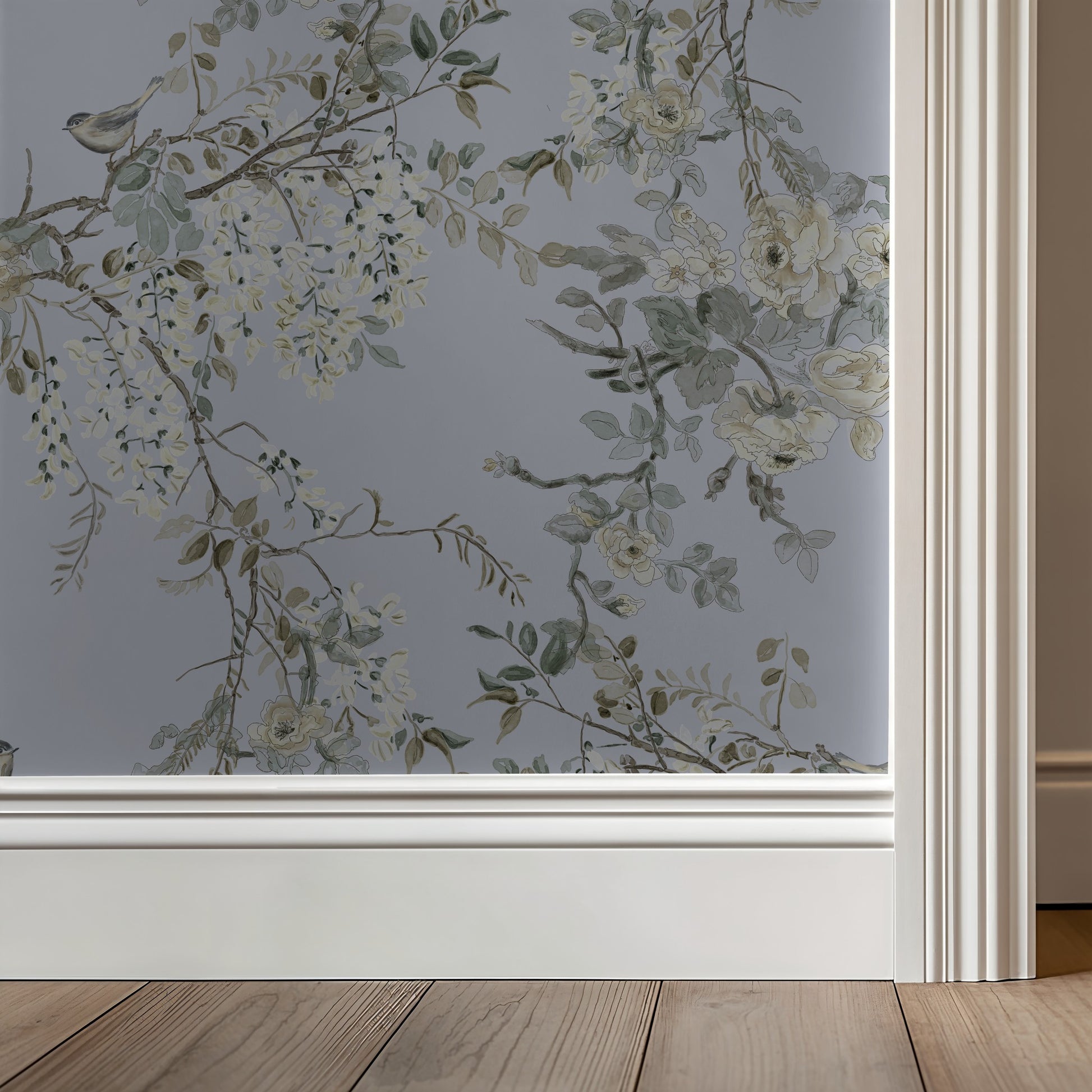 Floral patterned window film on a glass surface with wooden floor and wall in the background
