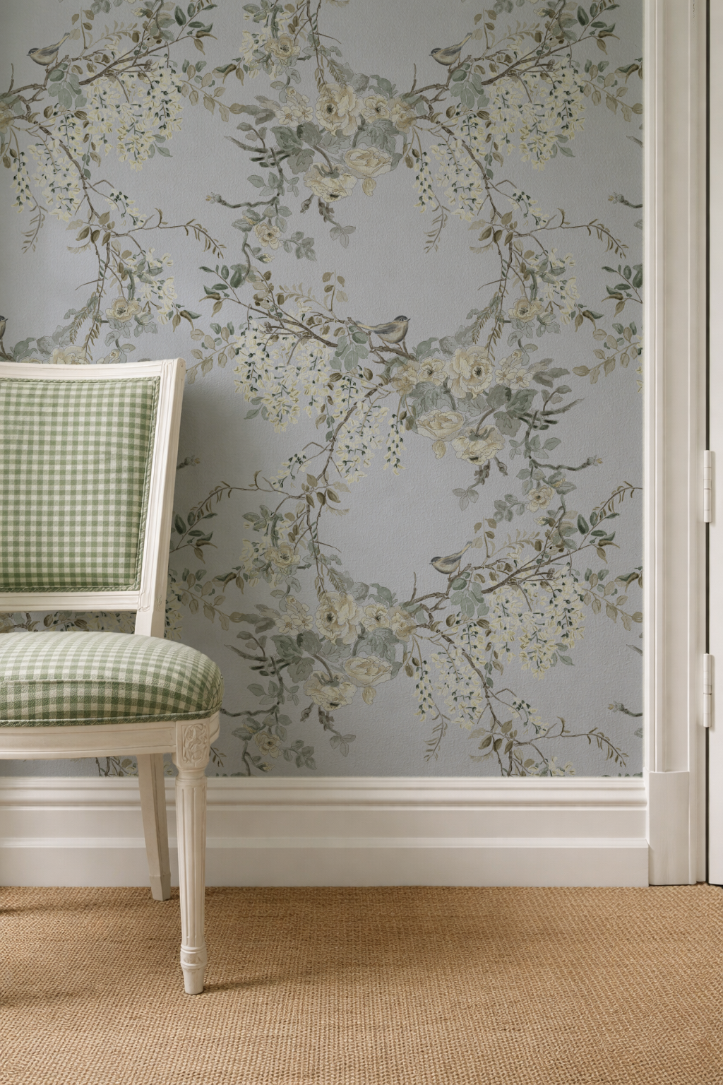 Floral wallpaper with a chair in front, on a light gray wall.