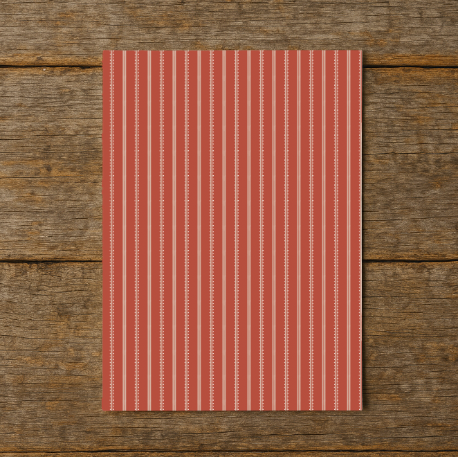 Red and white striped paper on a wooden surface