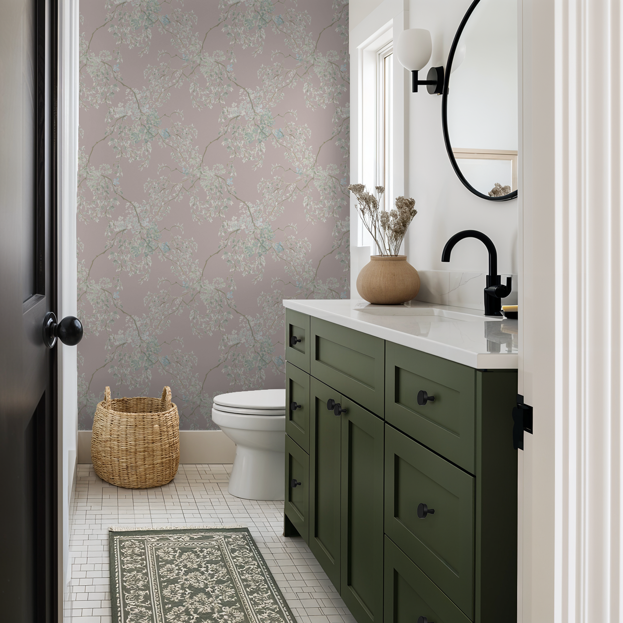 Bathroom with green vanity, white sink, and floral wallpaper.