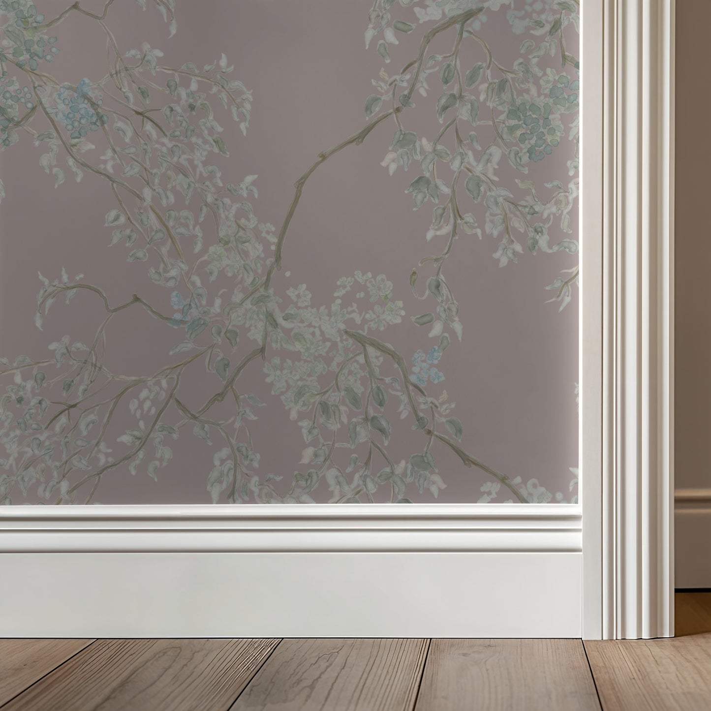 Window with a floral patterned privacy film on a neutral wall.