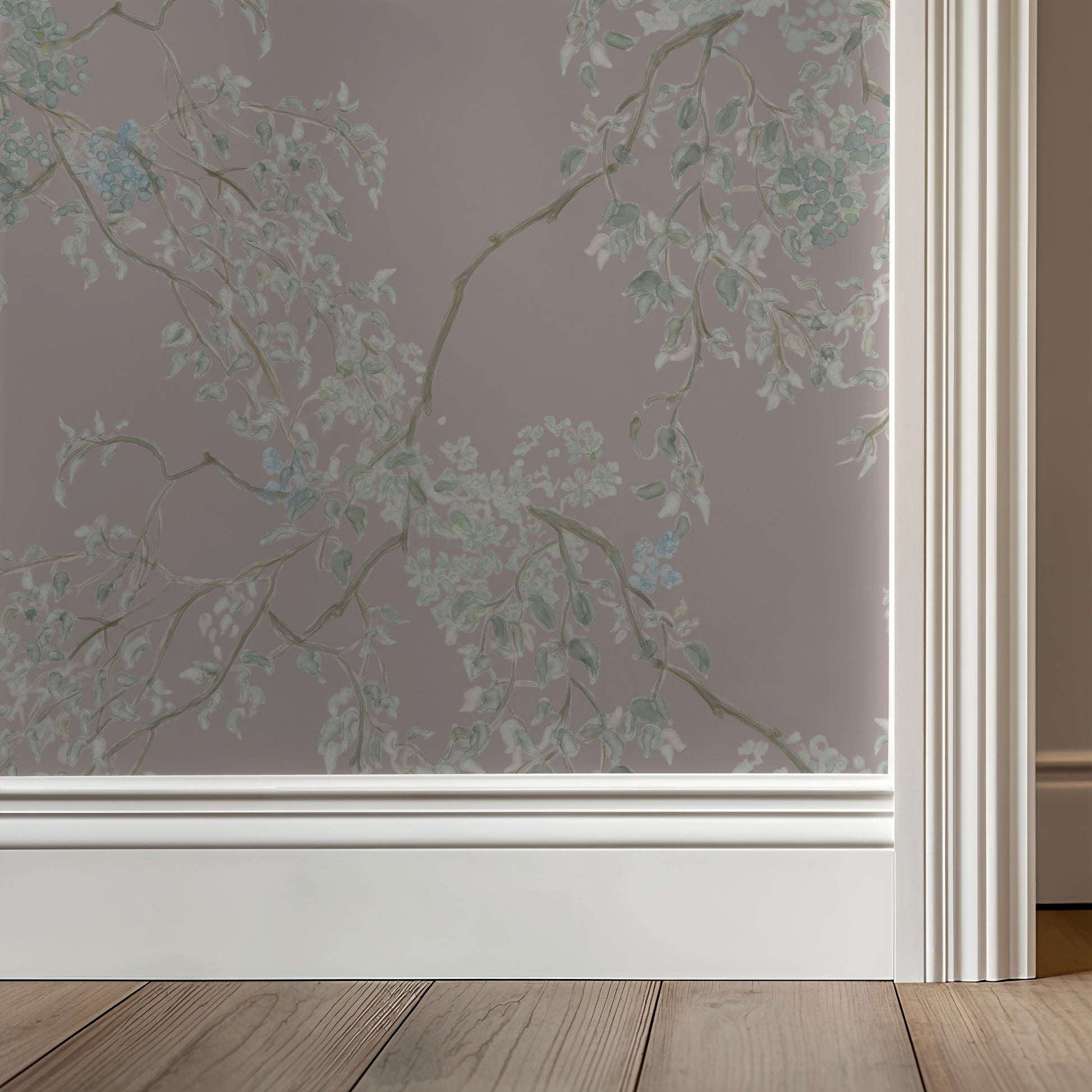 Window with a floral patterned privacy film on a neutral wall.