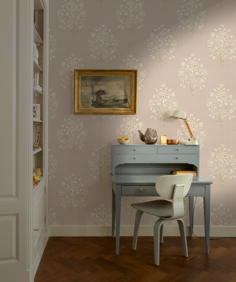 Home office with a desk, chair, and floral wallpaper.