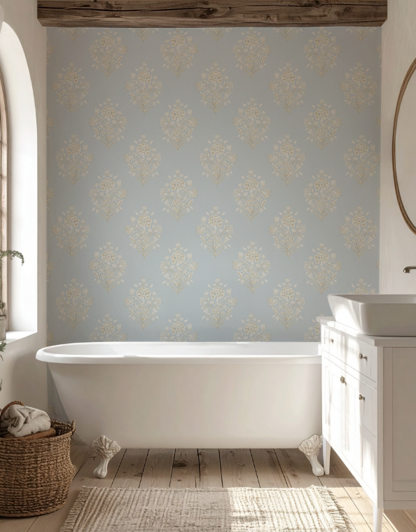 Bathroom with patterned wallpaper, freestanding bathtub, and wooden floor.