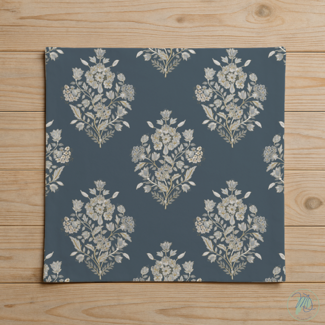 Floral patterned fabric swatch on a wooden background