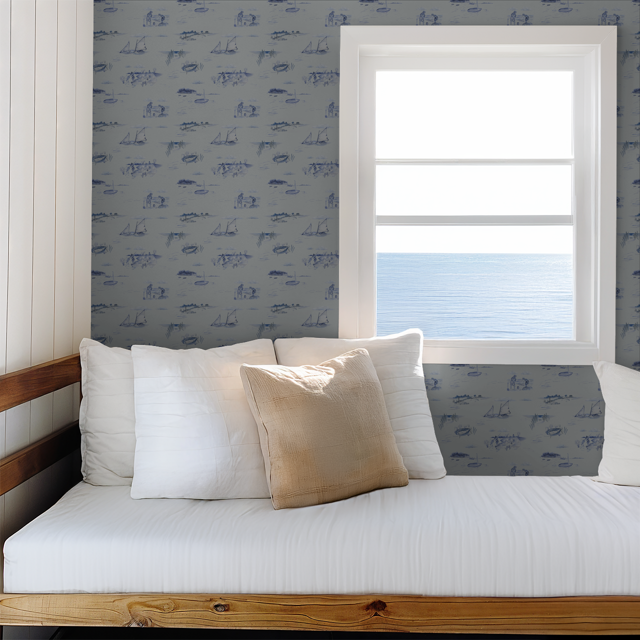 Bedroom with a bed against a wall with blue patterned wallpaper and a window.