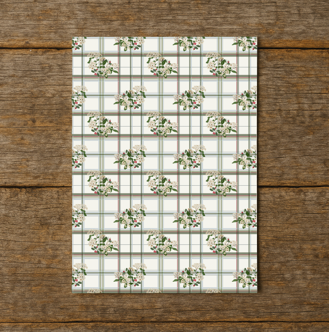 Floral grid pattern on a rectangular card with wooden background