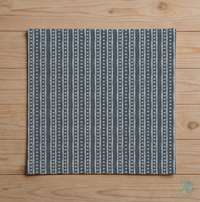 Textured blue and white patterned rug on a wooden floor