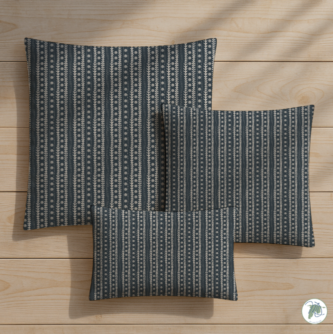 Three patterned pillows on a wooden surface