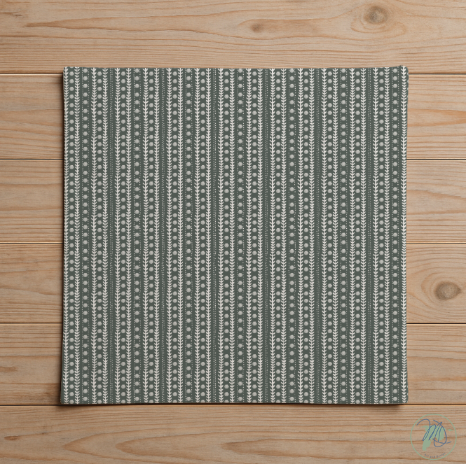 Textile with a green and white pattern on a wooden surface