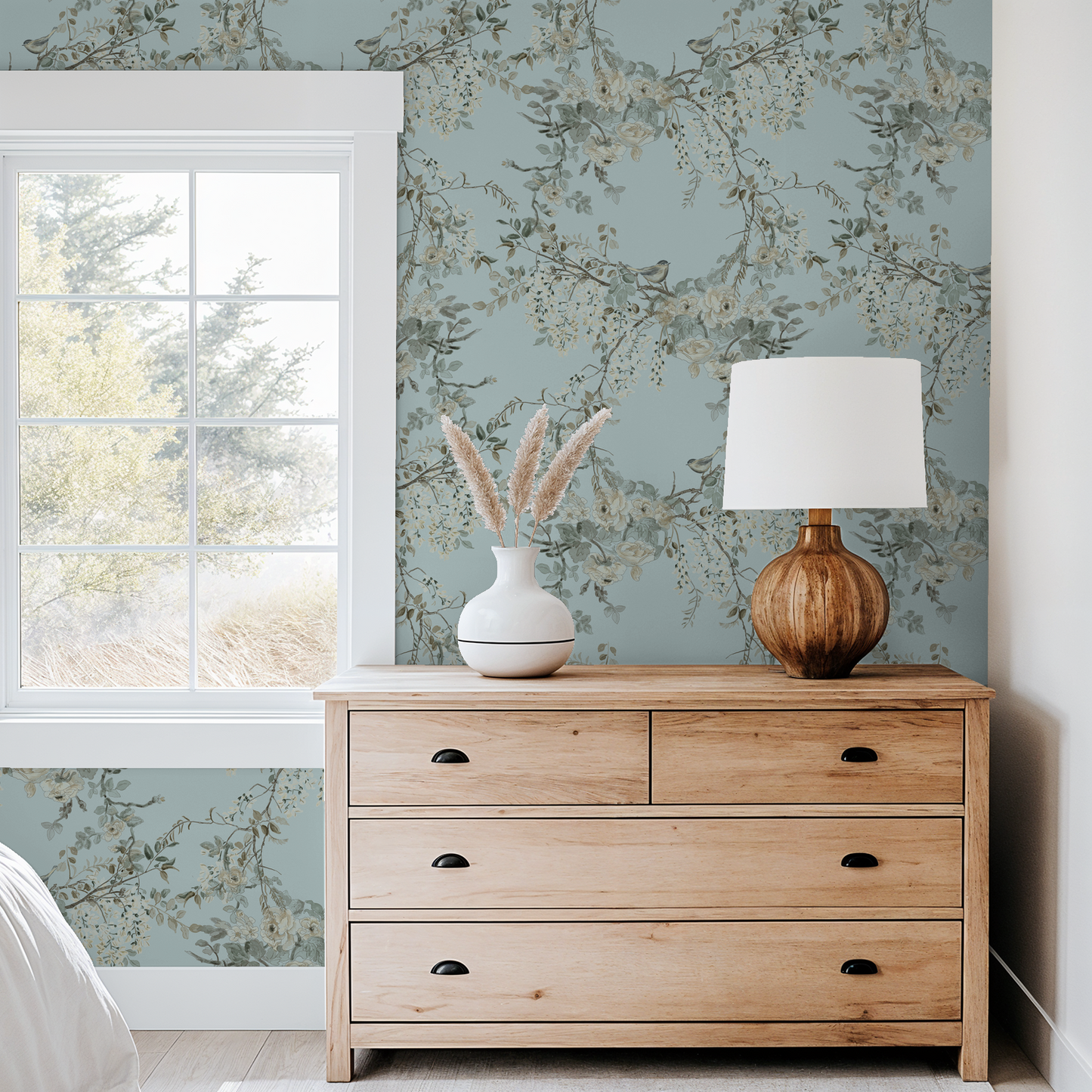Aqua floral wallpaper with birds in a serene bedroom setting.