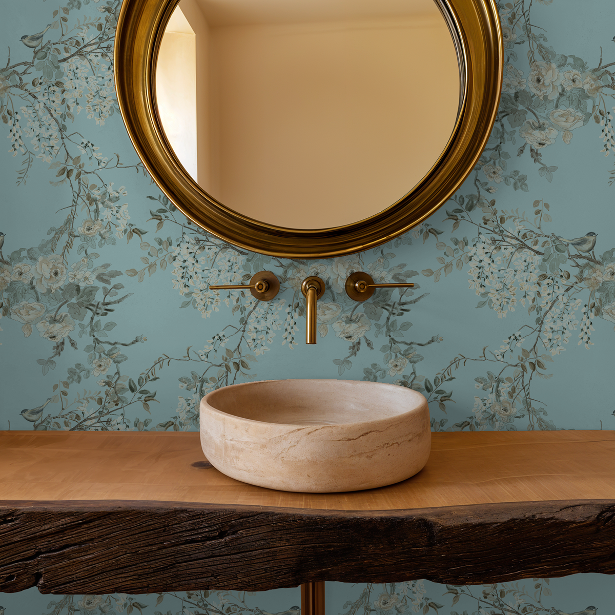 Elegant floral wallpaper with aqua backdrop and gold accents in bathroom setting.