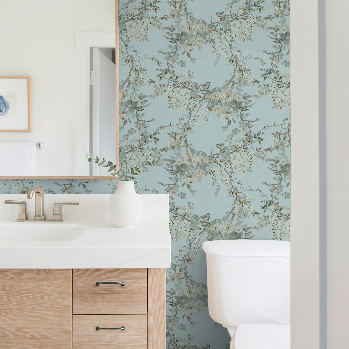 Aqua floral wallpaper with branches and blossoms in a modern bathroom setting.