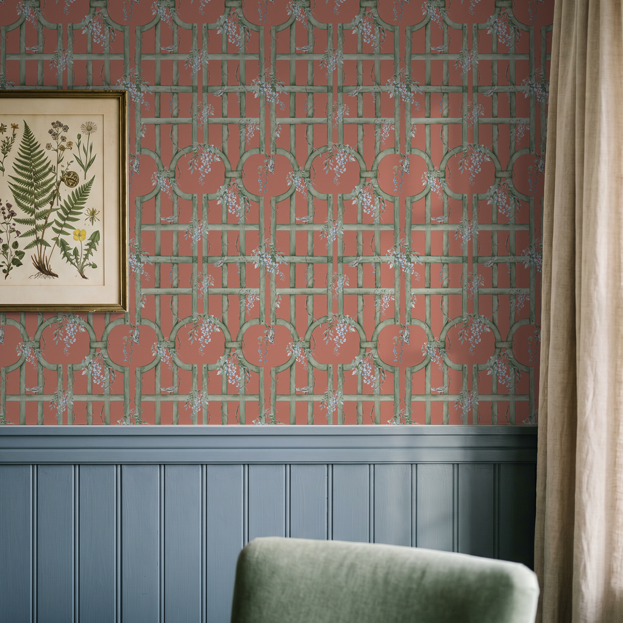 Blood orange wallpaper with green lattice and blue flowers in vintage room.