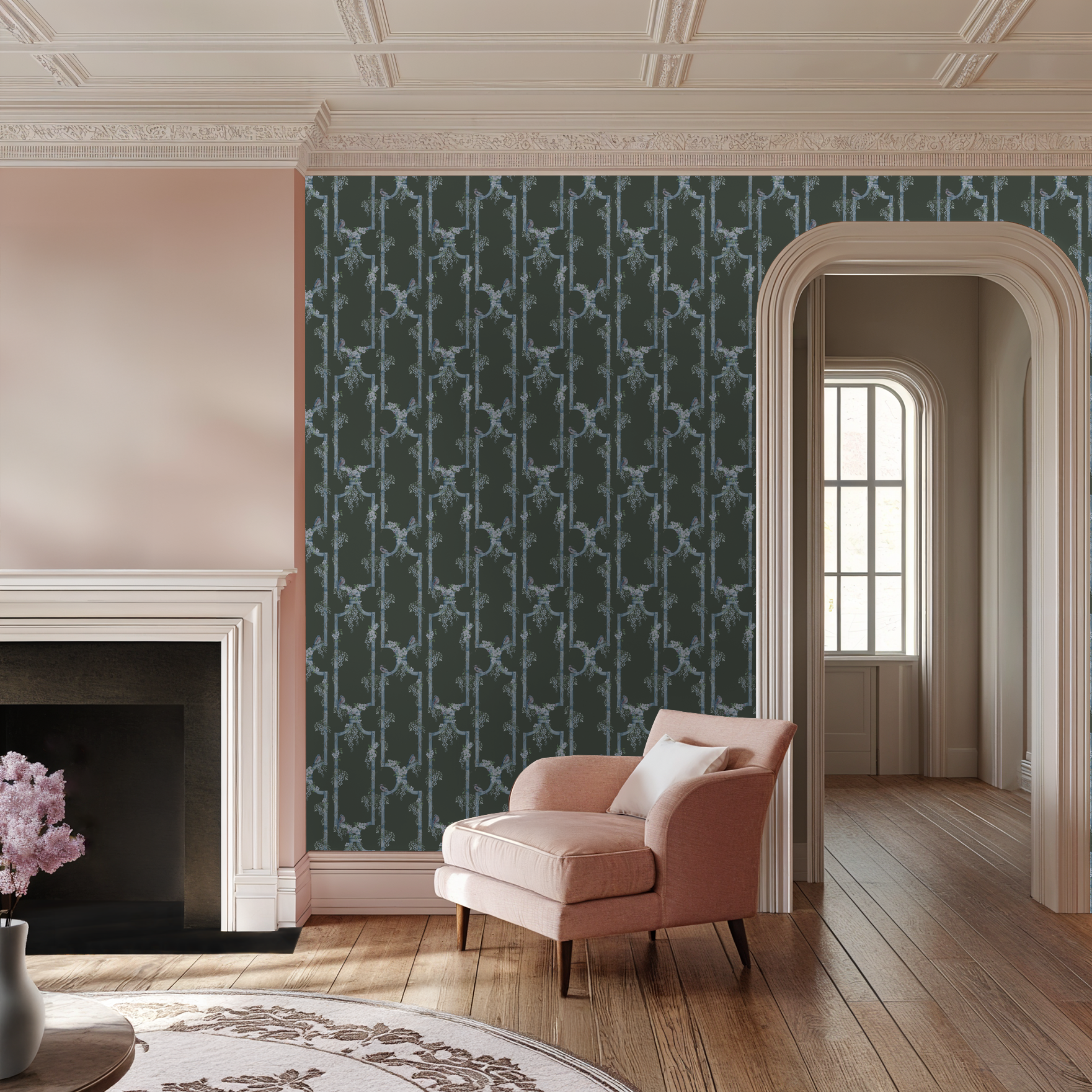 Elegant room with blue bird trellis wallpaper, pink chair, and fireplace.