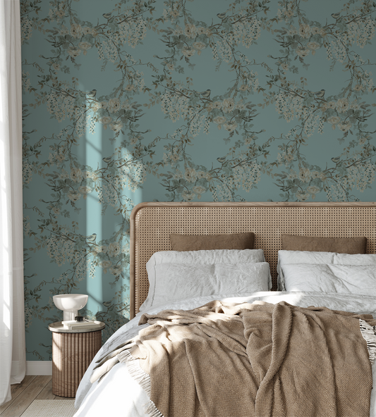 Blue floral wallpaper with birds in a serene bedroom setting.