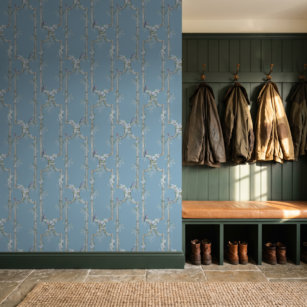 Blue trellis wallpaper with birds in rustic mudroom setting