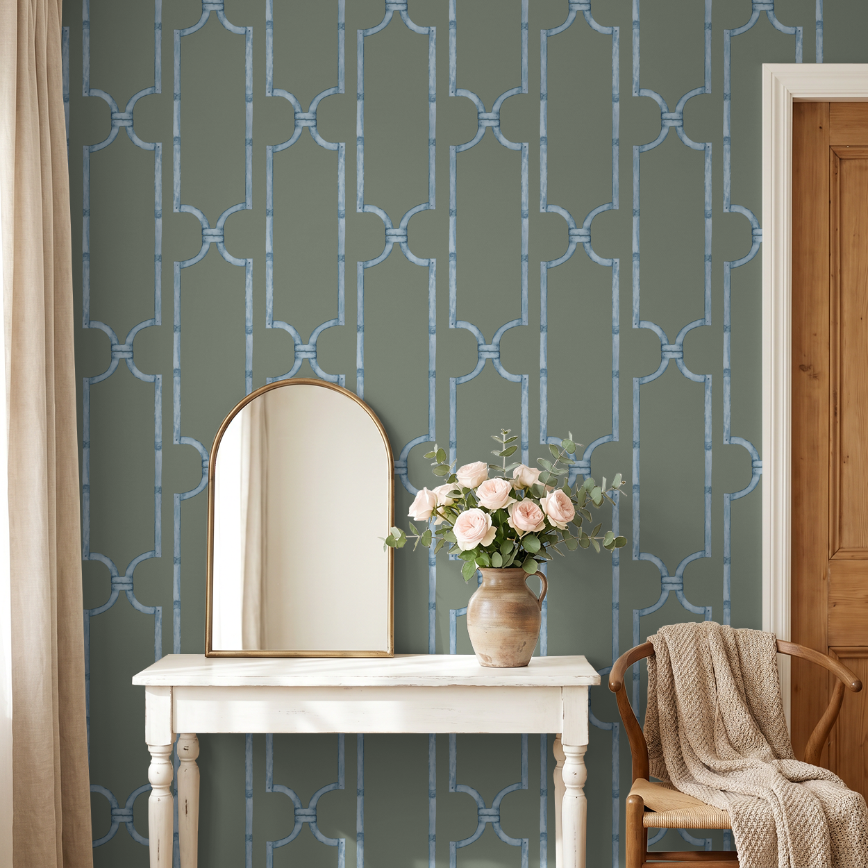Blue trellis pattern wallpaper in serene gray room with mirror and flowers.