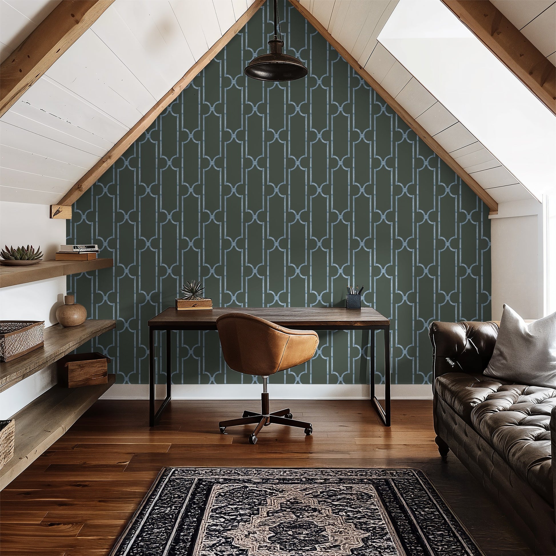 Blue trellis wallpaper in modern attic office with wooden desk and leather chair.