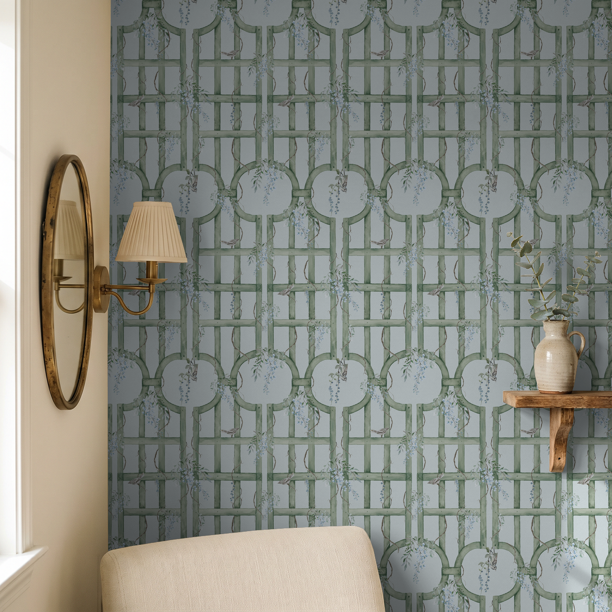 Bluebird Trellis wallpaper in soft blue and green with vines in a cozy room setting.