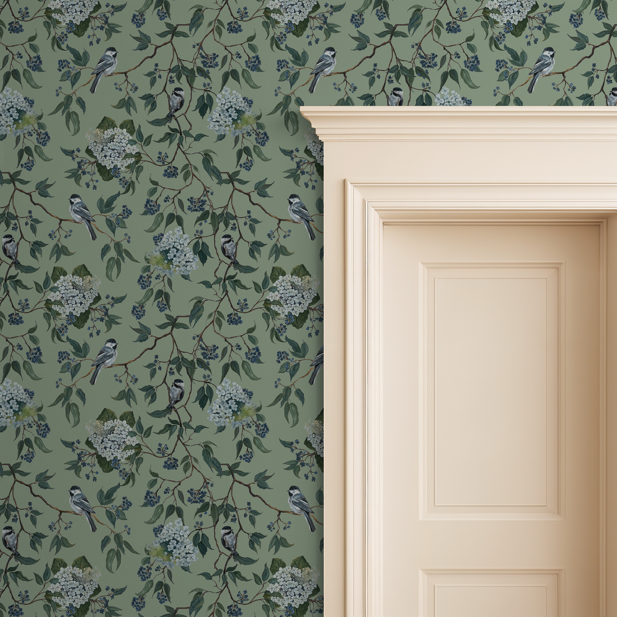 Botanical wallpaper with birds, branches, and blossoms on a green background next to a cream door.