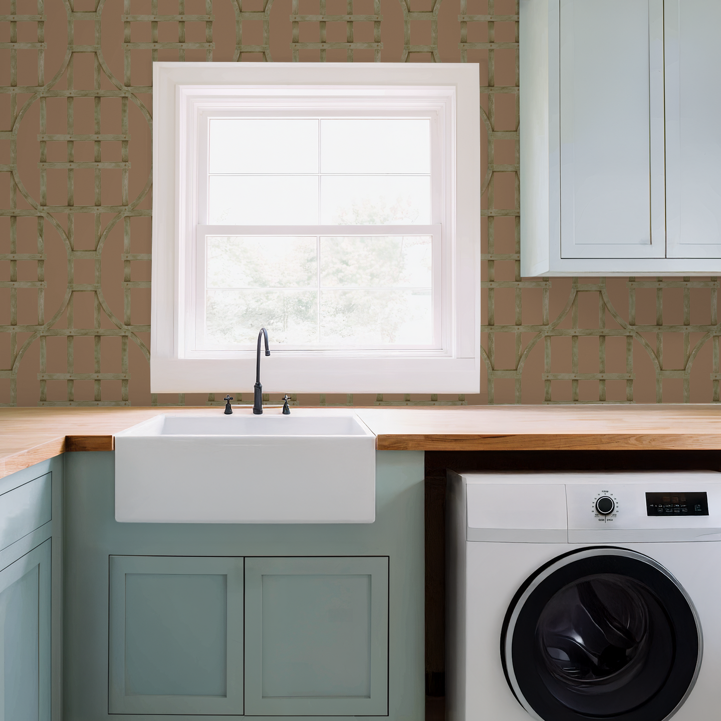 Burnt orange trellis wallpaper in a modern laundry room with mint cabinets.