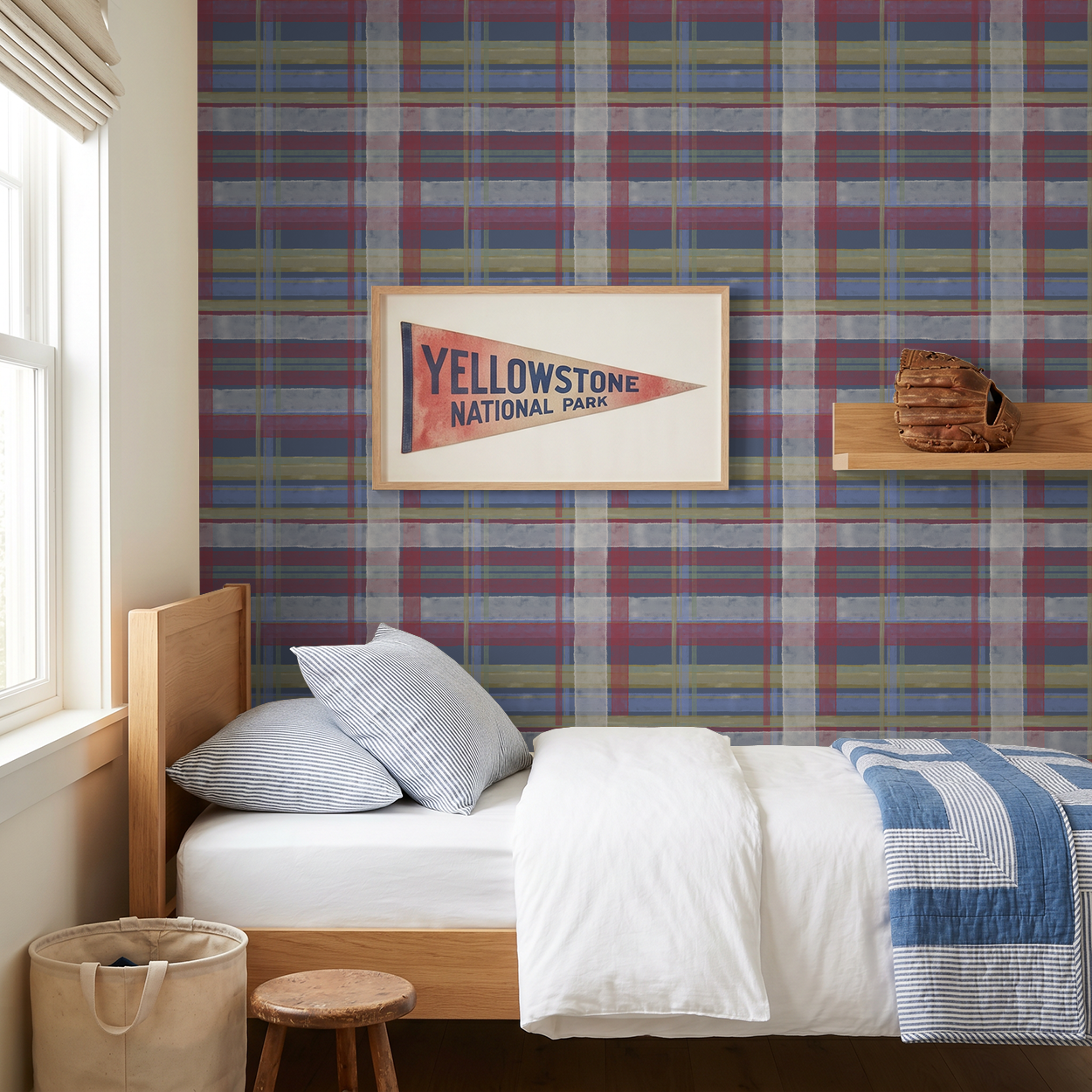 Coastal cottage plaid wallpaper in navy, red, and gold in cozy bedroom setting.
