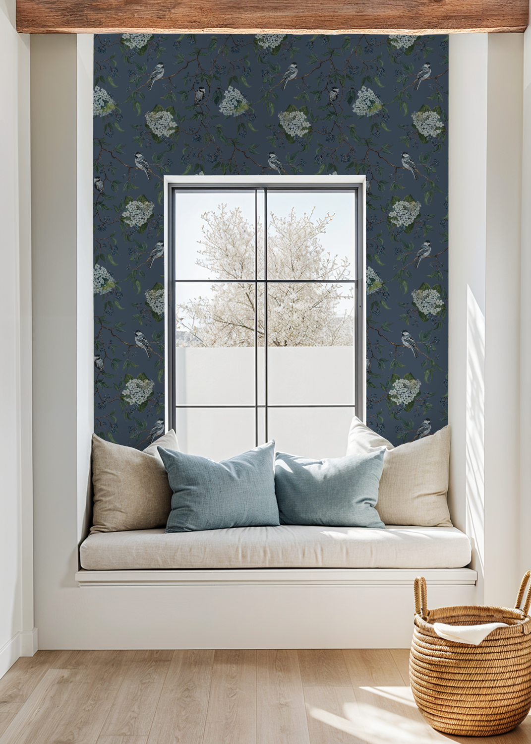 Deep blue floral wallpaper with birds in cozy window nook setting.