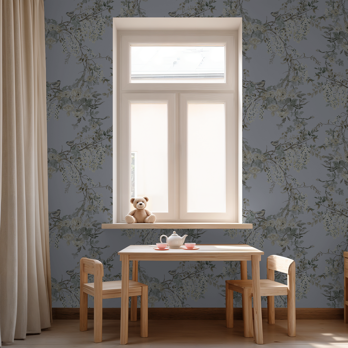 Dusty periwinkle floral wallpaper with birds in a cozy room with wooden table and teddy bear.