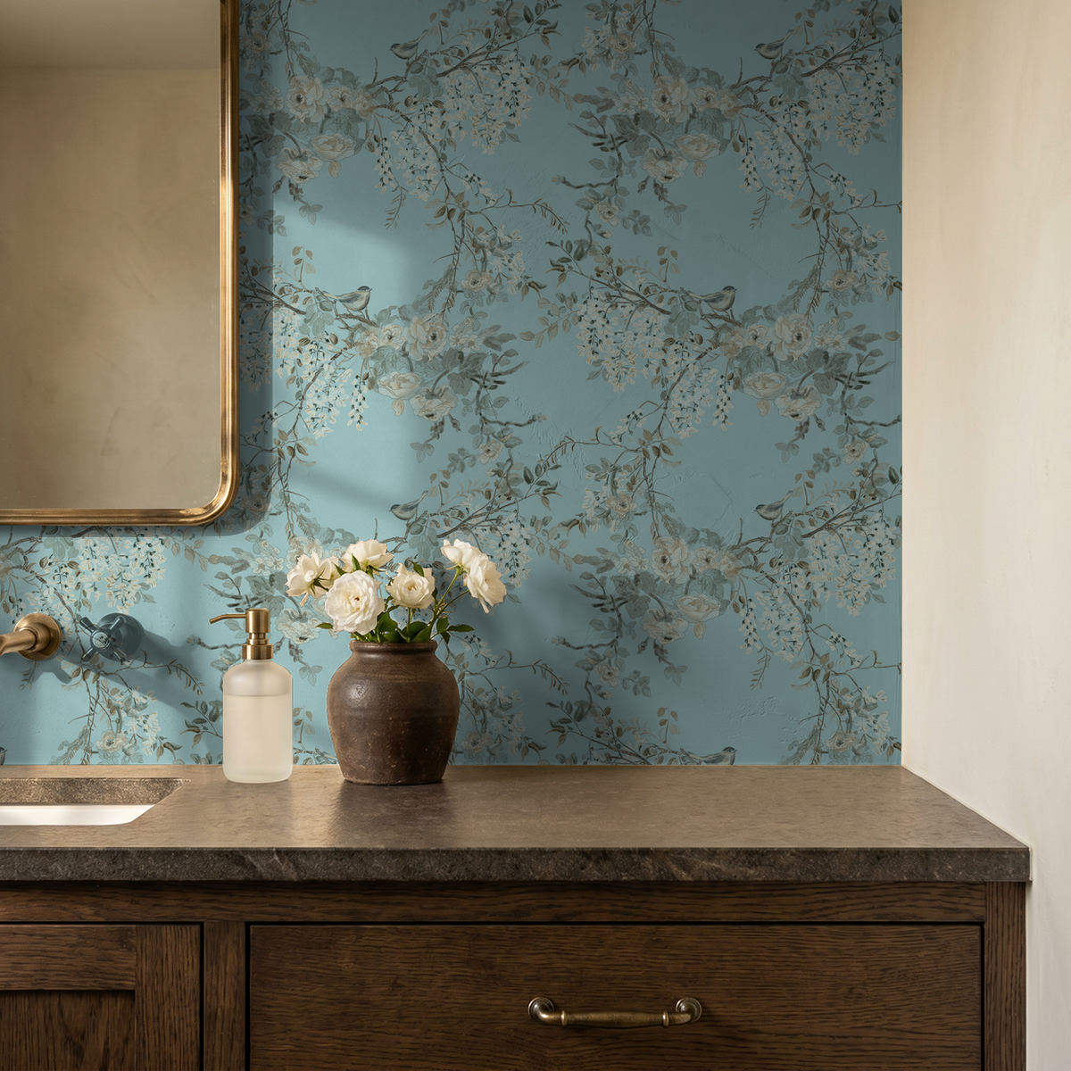 Elegant blue floral wallpaper with delicate branches in a rustic bathroom setting.