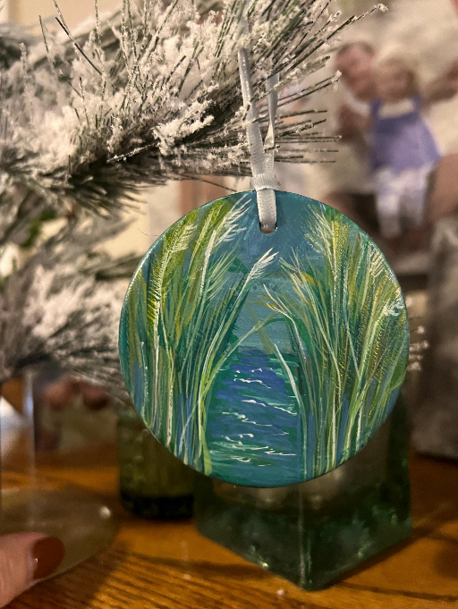Round decorative ornament with nature design on a tree