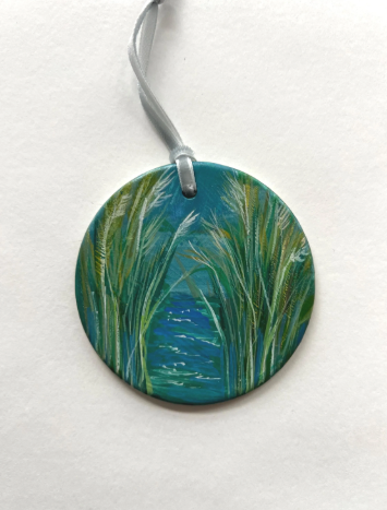 Round pendant with nature design on a white background