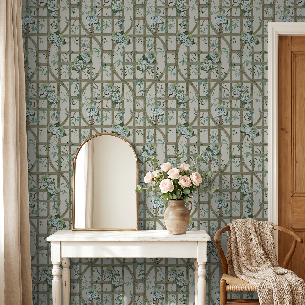 Floral hydrangea trellis wallpaper in cozy room with mirror and vase on table.