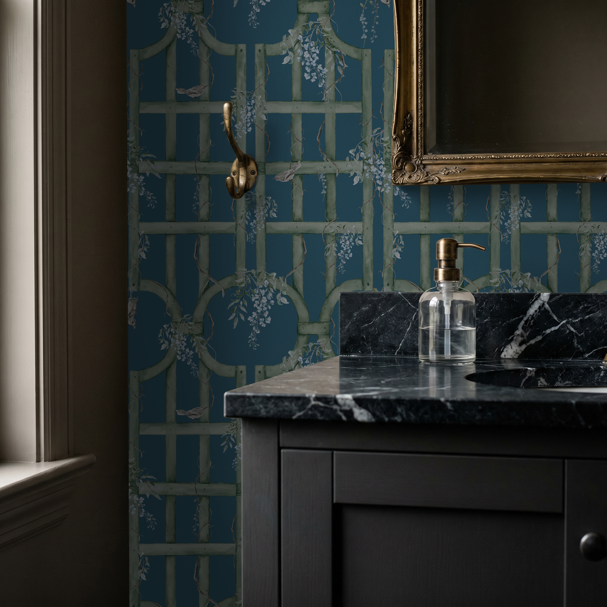 Floral trellis wallpaper in teal and sage green in a bathroom setting with marble sink.