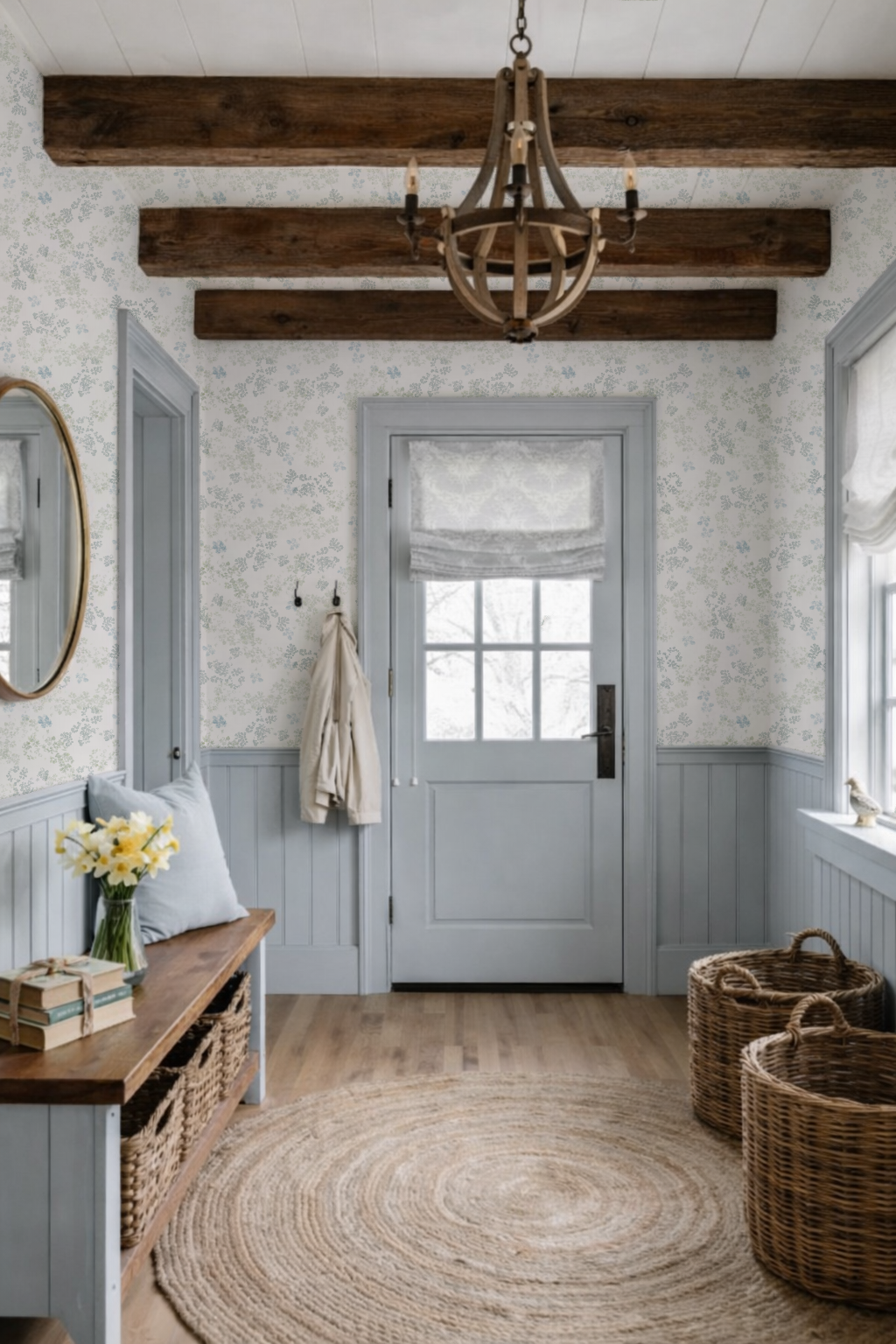 Foyer with wooden bench, wicker baskets, and a chandelier.