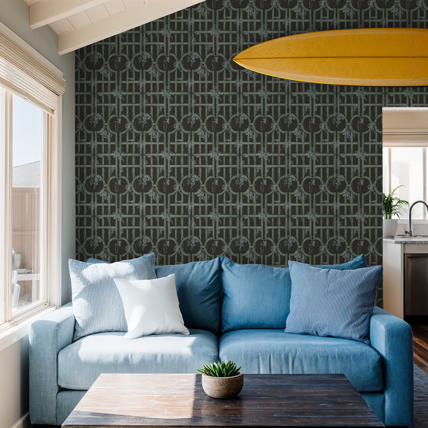 Green trellis wallpaper with blue flowers in cozy living room with blue sofa.