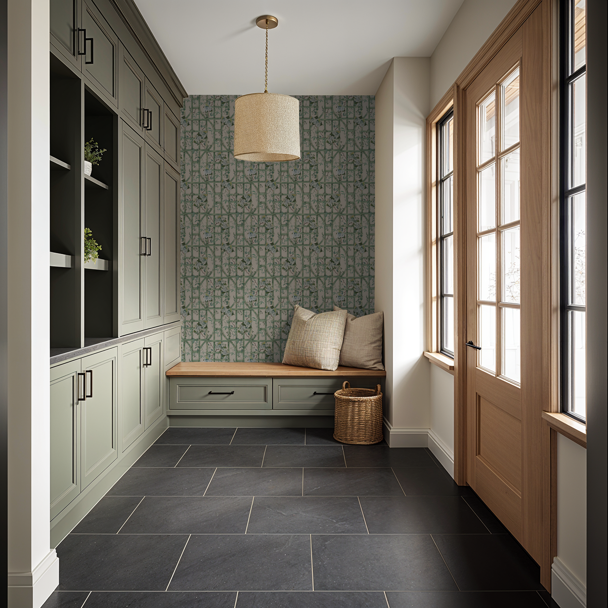 Green trellis and hydrangea wallpaper in a cozy entryway with bench and cabinets.