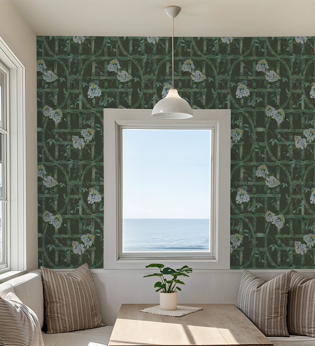 Green trellis wallpaper with white hydrangeas in cozy dining nook.